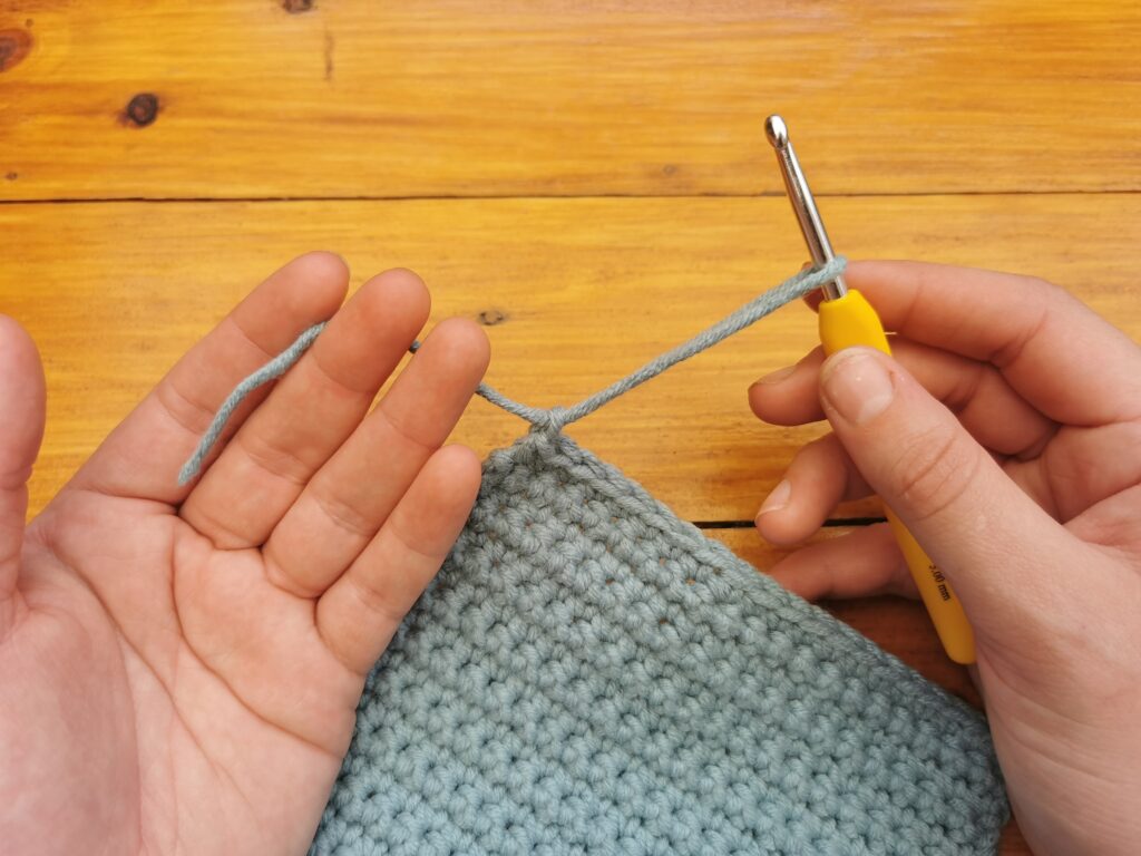 Pull the yarn completely through the loop